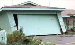 Leaning single storey garage did not have a seismic retrofit to prevent earthquake damage